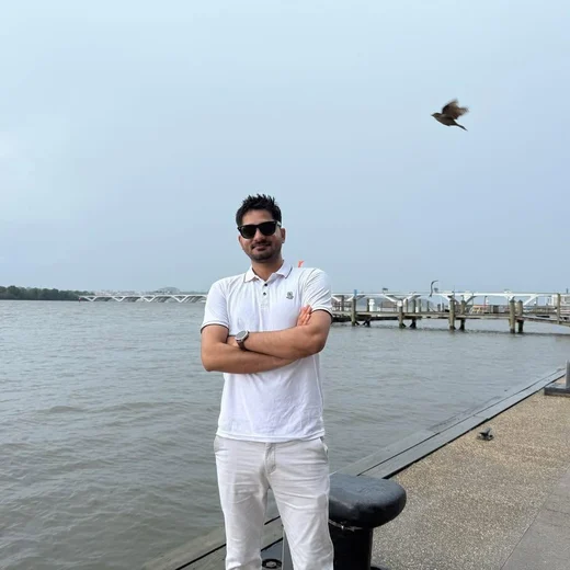 Ananta Mishra on a waterfront pier