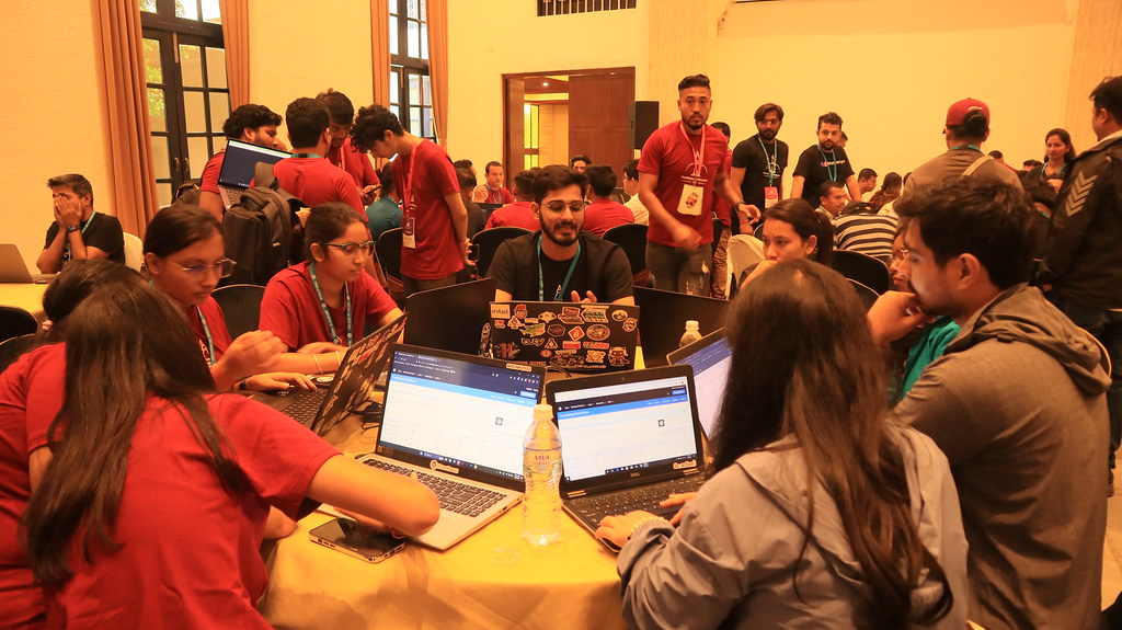 WordPress Polyglots team collaborating with GlotPress open on laptops