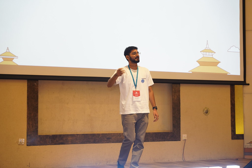 Ananta Mishra presenting Translating WordPress into Nepali on the main stage at WordCamp Kathmandu 2023