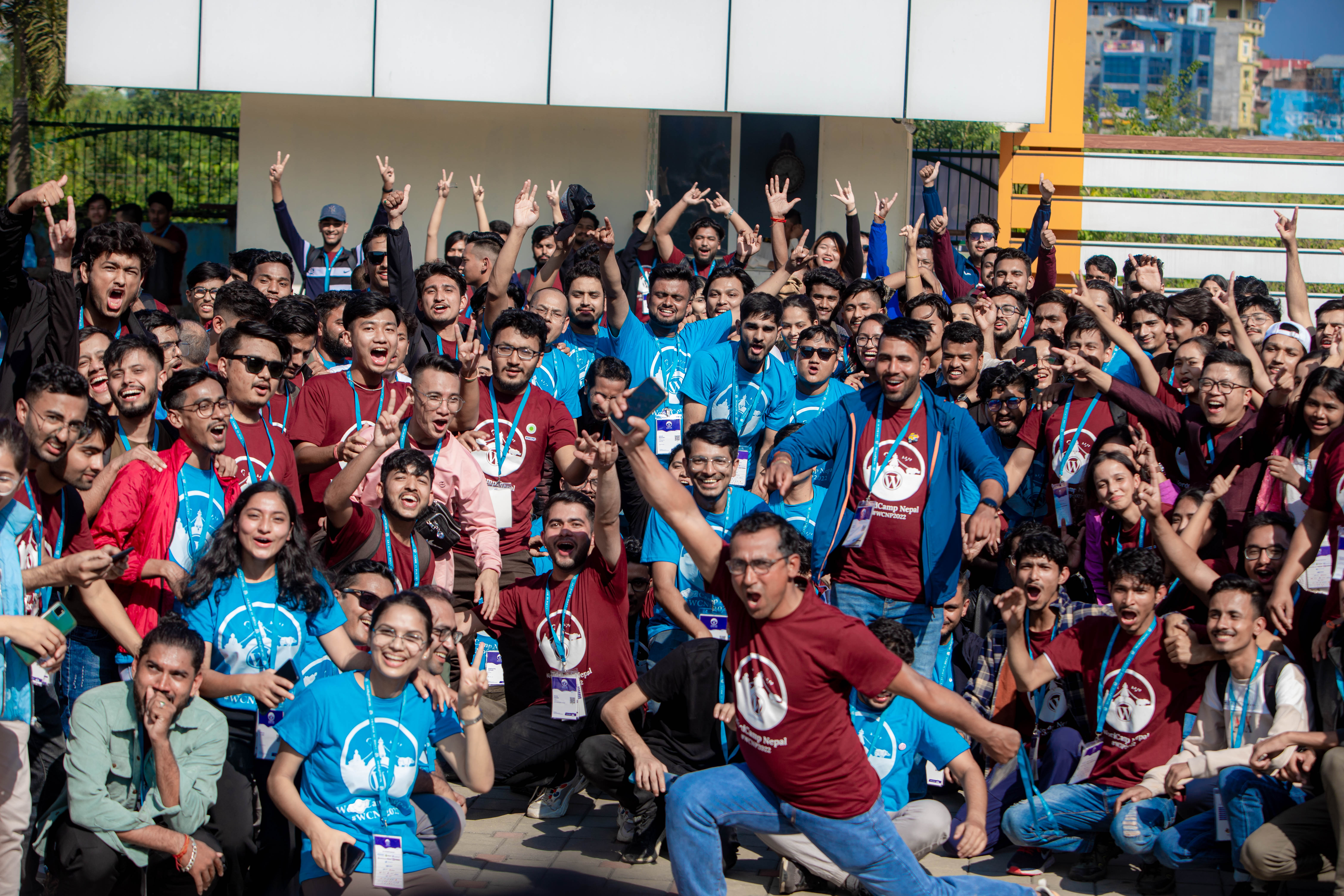 WordCamp Nepal 2022 attendees and organizers gathered outdoors at Chitwan Garden Resort