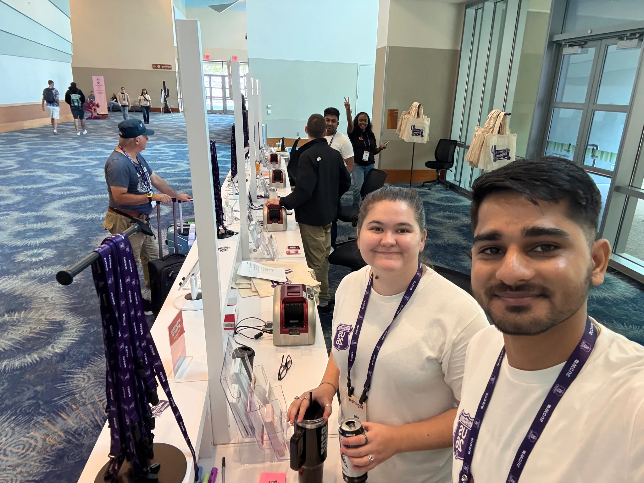 Behind the registration counter selfie with fellow volunteer teammate